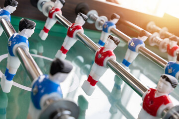 Close-up image of plastic players in a table football game. Table football in the entertainment center. - 506650037
