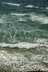 Aerial view of waves in the Mediterranean Sea at Herzliya Beach in Israel.