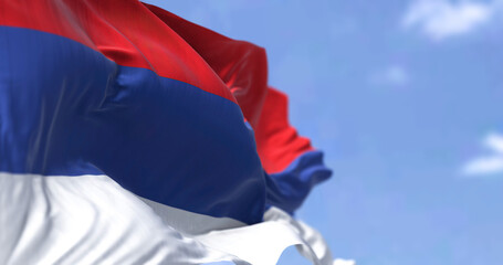 The flag of Republika Srpska waving in the wind on a clear day