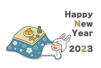 こたつでくつろぐウサギの着ぐるみを着た男性(2023年うさぎ年の年賀状)