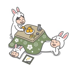 こたつでくつろぐウサギの着ぐるみを着た3人家族(2023年うさぎ年の年賀状)