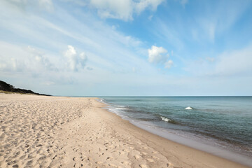 Beautiful view of sea shore and blue sky on sunny day