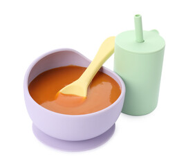 Healthy baby food in bowl and drink on white background