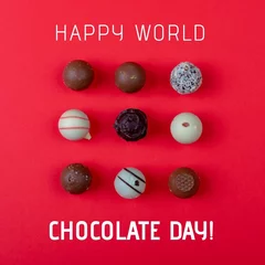 Wandcirkels aluminium Composite image of happy world chocolate day text with chocolate balls on red background, copy space © vectorfusionart