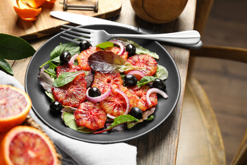 Delicious sicilian orange salad served on wooden table