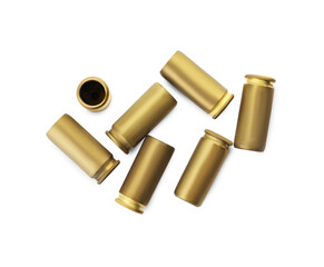 Shells of bullets on white background, top view