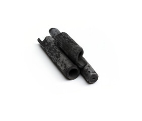 Black bamboo charcoal sticks are placed on a white background.