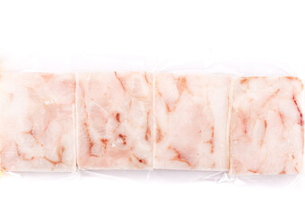 Pressed frozen pollock fillets in vacuum packaging on a white background.