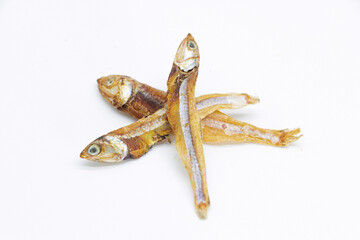 Dried Small fish or Salted anchovy fishes isolate on white background,