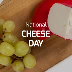 Tuinposter Composite of national cheese day text with cheese by grapes on wooden board, copy space © vectorfusionart