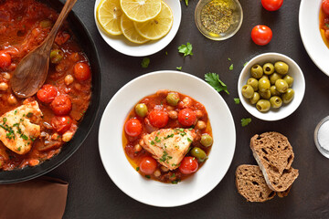 Cod stew with chickpeas, cherry tomatoes and olives