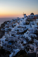 Fototapeta na wymiar Twilight over Santorini famous view. Vacation in Greece.