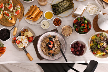Many different dishes served on buffet table for brunch, flat lay
