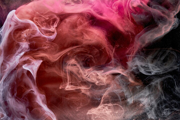 Multicolor pink smoke on black ink background, colorful fog, abstract swirling touch ocean sea, acrylic paint pigment underwater