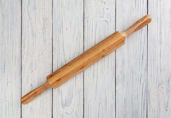 Rolling pin on white wooden table