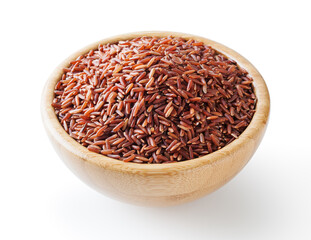 Uncooked red rice in wooden bowl isolated on white background with clipping path
