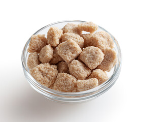 Cubes of brow cane sugar in glass bowl isolated on white background with clipping path