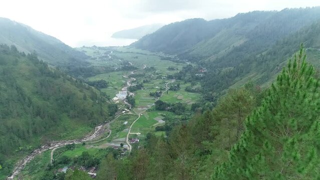 Bakkara valley with Tree Foreground in northern Sumatra Indonesia - Aerial