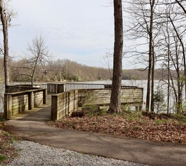 The wood overlook deck at the lake in the park.