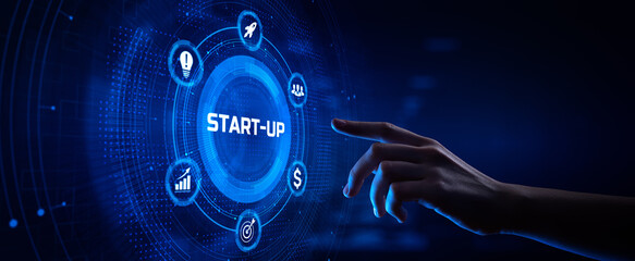 Startup new business development concept. Hand pressing button on screen.