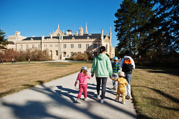 Obraz premium Happy family, enjoying day in Lednice castle in Czech republic.