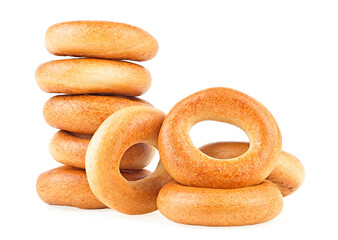 Delicious bread rings isolated on a white background. Pile of fresh bagels.