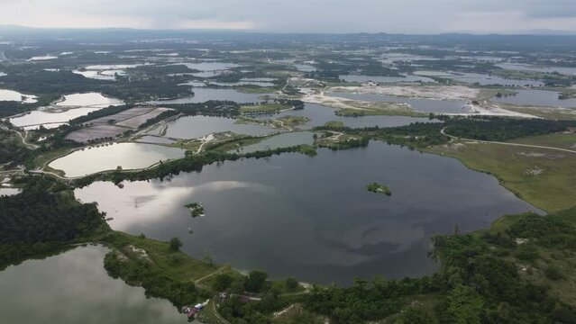 Aerial view reflection at abandoned tin mining lake at Kampar, Perak in overcast day