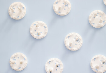 Fototapeta premium Baby Safety Child Electric Socket Plug Protection bear shape on light blue background. pattern or in a row at the edge of page. space for text,mockup.baby care. careful mother using plug protection.