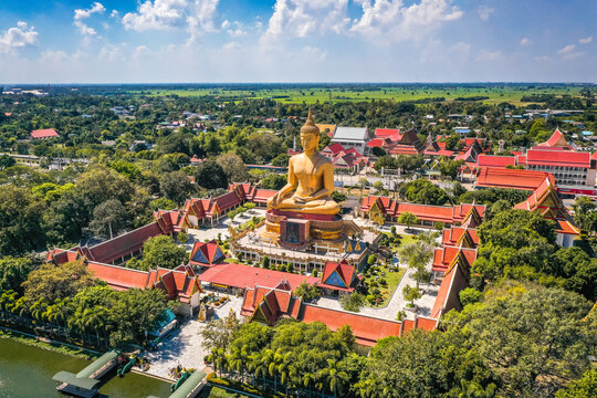 Aerial view of Wat Pikul Thong Phra Aram Luang or Wat Luang Por Pae temple with giant Buddha, in Sing Buri, Thailand