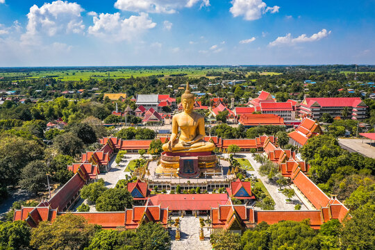 Aerial view of Wat Pikul Thong Phra Aram Luang or Wat Luang Por Pae temple with giant Buddha, in Sing Buri, Thailand