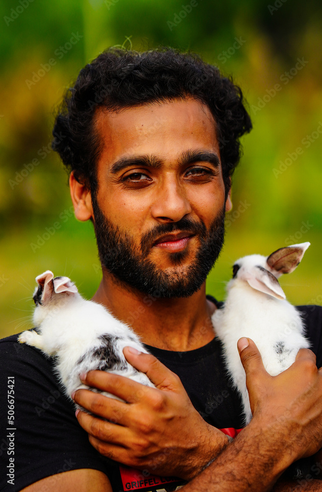 Poster boy with cute Rabbit pet animal