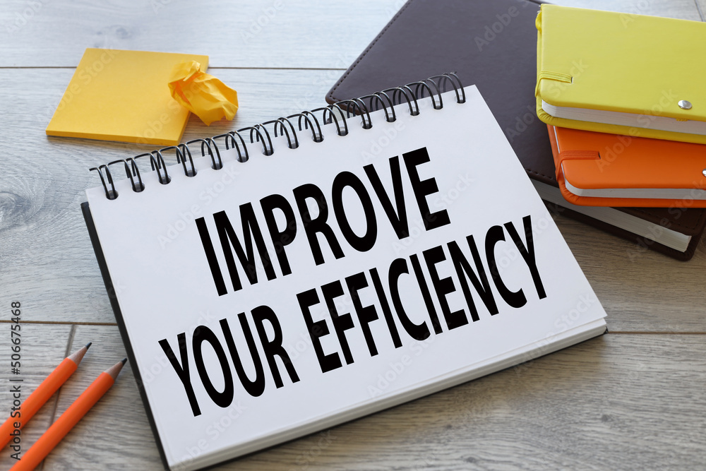Poster improve your efficiency. open notepad near orange clips and yellow notepad