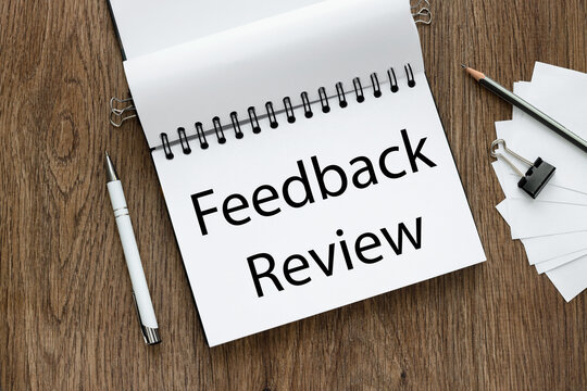 feedback review. open notepad with text near white stickers