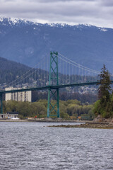 Lions Gate Bridge in a modern city on the West Coast of Pacific Ocean. Vancouver, British Columbia, Canada.