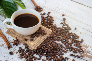 Black coffee mug and roasted coffee beans