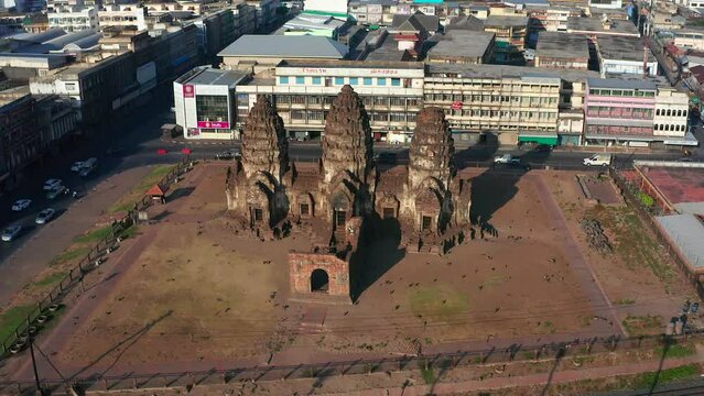 Aerial view of Pra Prang Sam Yod or Phra Prang Sam Yot ruin temple with monkeys, in Lopburi, Thailand