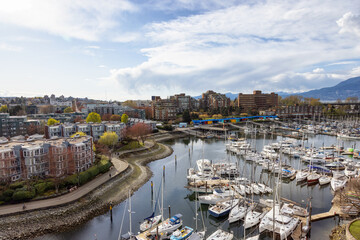 Obraz premium Aerial View of Residential Homes, Boats in Marina and Modern Cityscape. False Creek, Downtown Vancouver, British Columbia, Canada.
