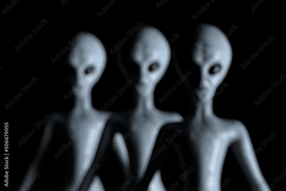 Poster blurred background row of scary gray humanoid aliens. 3d rendering