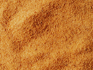 Background texture of raw organic coconut sugar from crystallized sap of cut flower buds coconut...
