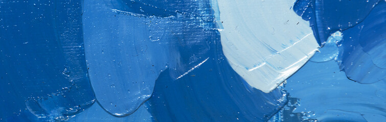 Blue abstract background. Blue close up of different color oil paint.