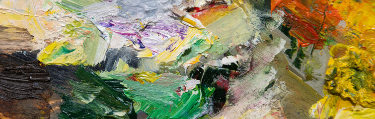 Colorful abstract background. Close up of different color oil paint