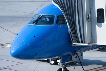 blue airplane at the airport