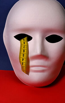 Diet Concept With Measuring Tape And White Mask