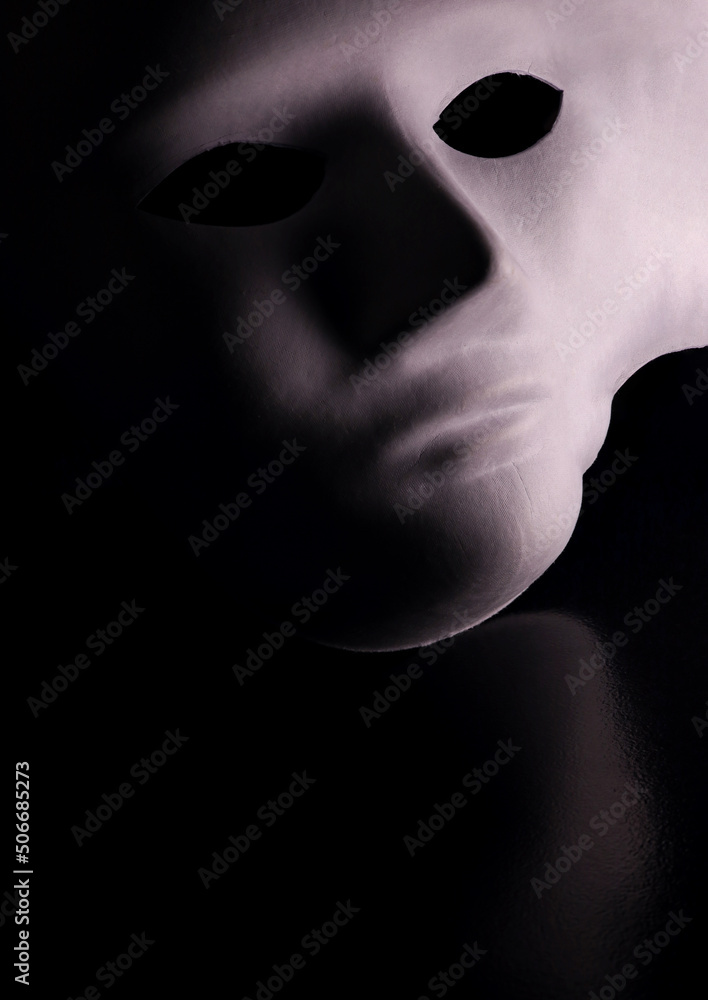 Wall mural white mask isolated on black background