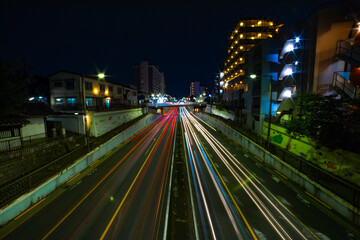 Fototapeta na wymiar A night traffic jam at the downtown street in Tokyo wide shot