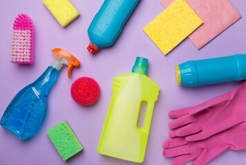 Many different house cleaning products on color background, top view
