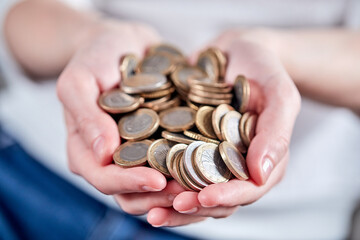 woman hands with euro coins