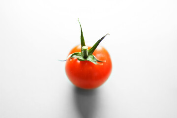 red tomato on a white