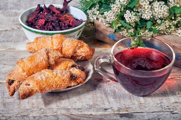 Cup of tea and cookies on a wooden table