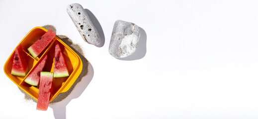 Fresh watermelon slices with sunlight on box container